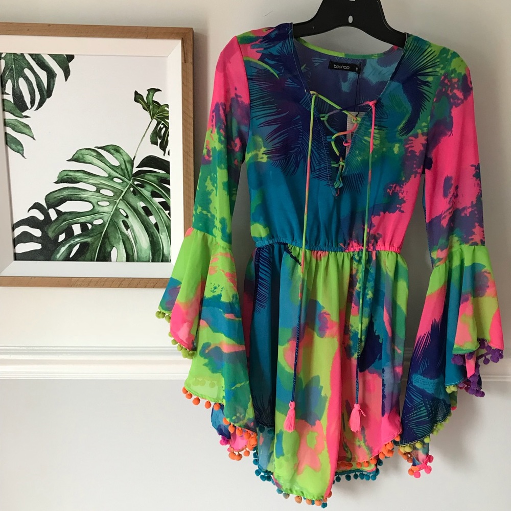 Neon top or bathing suit cover up with pom poms